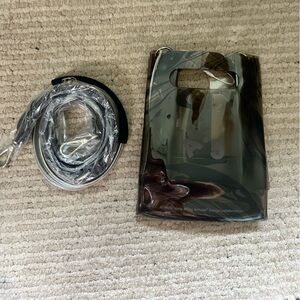 Nana-Nana A5 PVC mini tote in black safari 
NWT
Dust bag and 2 straps included